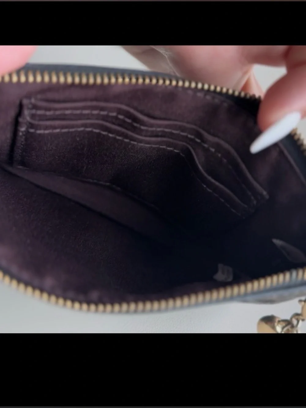 Coach Black Embossed Signature Wristlet with Gold Logo